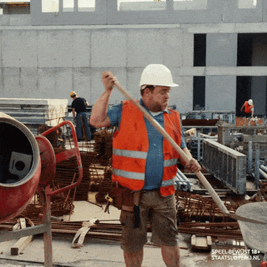 Background Gif of construction worker shoveling cement into a mixer.