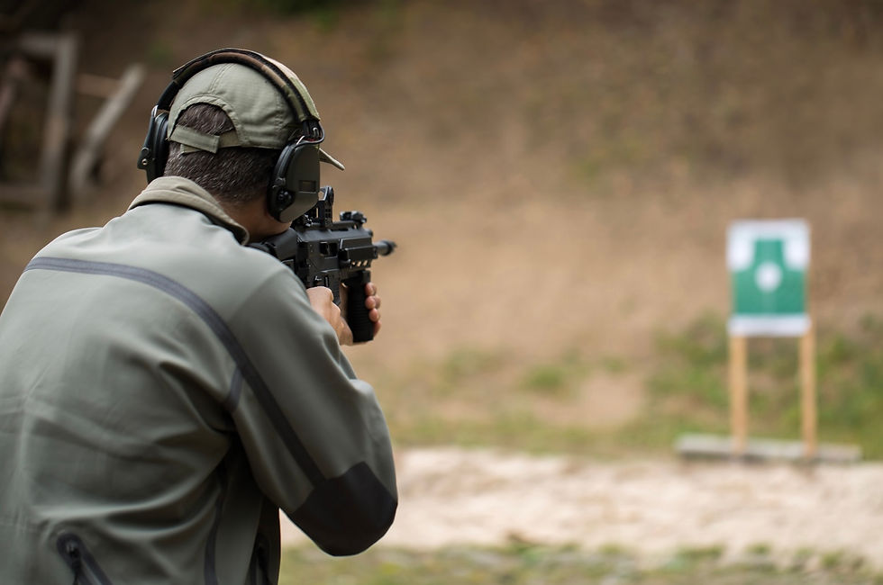 Private security team member training with rifle at outdoor shooting range, representing special forces training for security teams