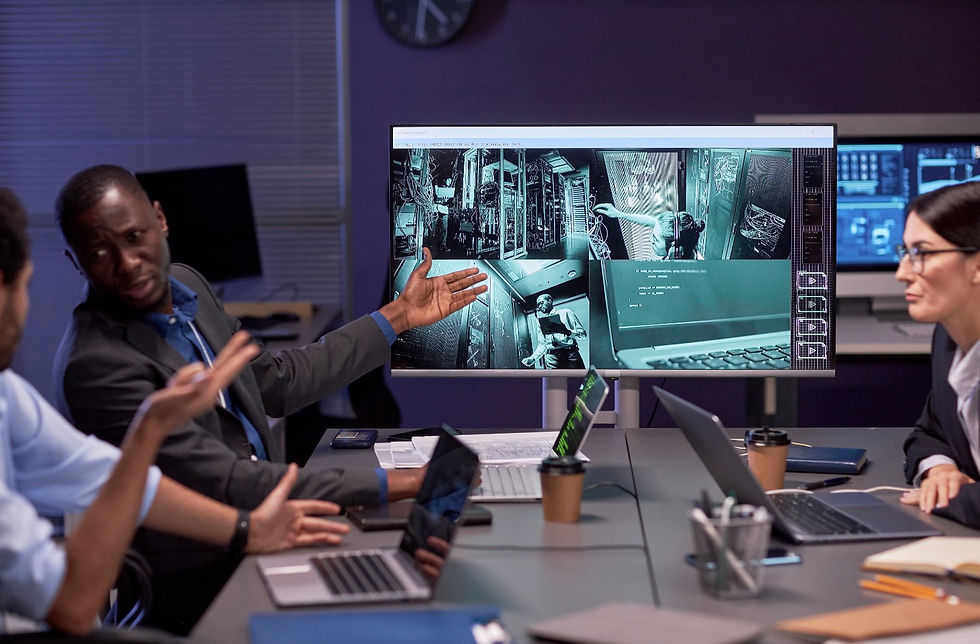 Security professionals reviewing surveillance footage in a control room, illustrating how hybrid attacks bypass modern security by blending in