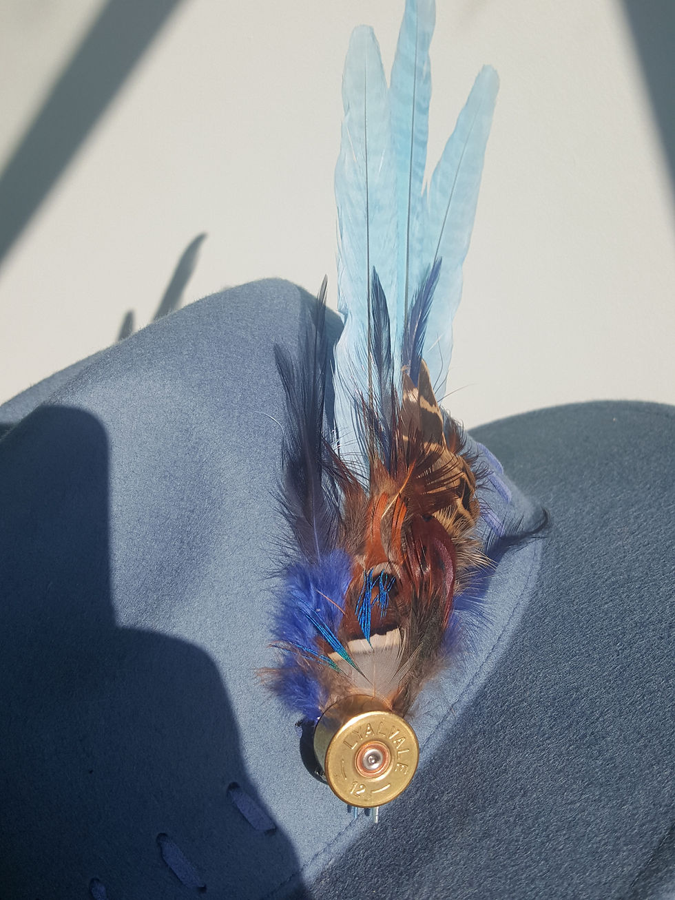 Thumbnail: Pale blue trilby with Shotgun catridge and feather adronment