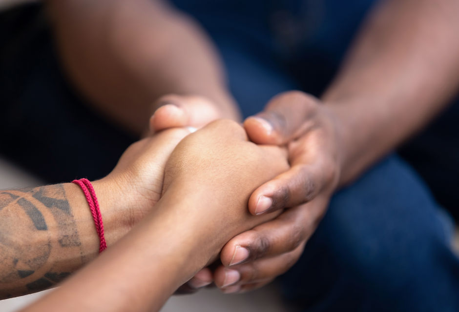 Black man friend holding hands of african woman, american family couple give psychological