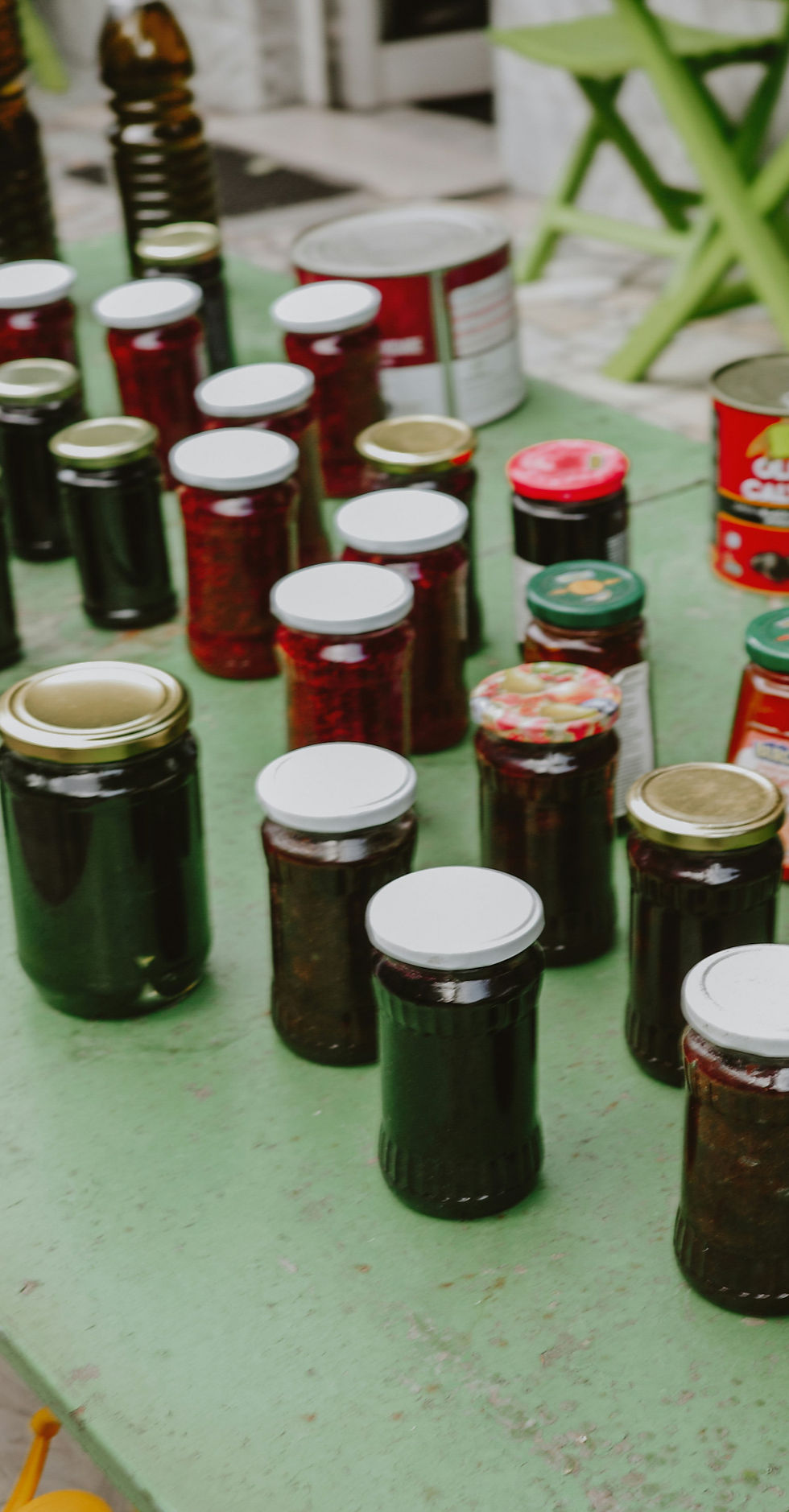 An image of food being preserved after harvest either through canning or in glass jars.