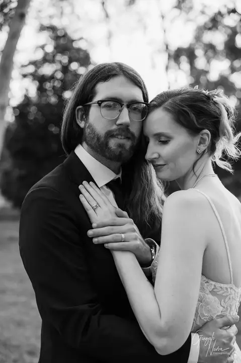 Bride and groom embracing closely during golden hour at Aintree Cottage in Herne Hill, WA.