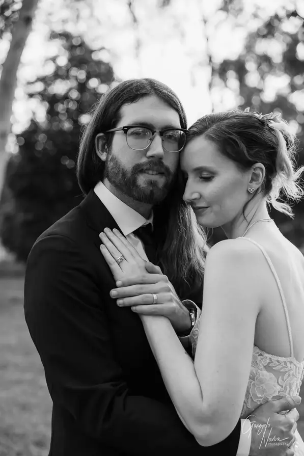 Bride and groom embracing closely during golden hour at Aintree Cottage in Herne Hill, WA.
