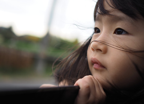 Child Looking Outdoors