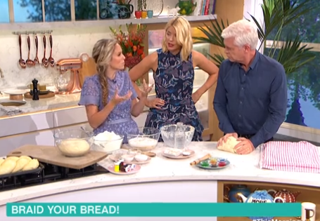 Here's Allegra, the Challah Mummy, showing Philip and Holly how to braid 6 strand rainbow challa