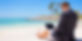 Business man working on a sandy beach