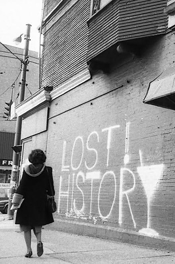 Historical photo of street graffiti reading 'Lost History' in Vancouver