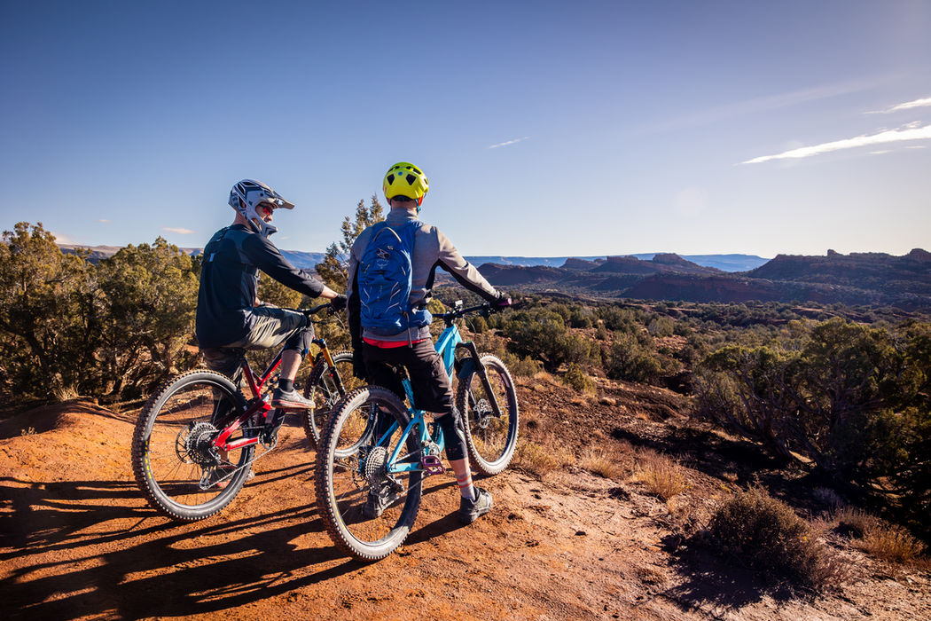 Mountain bikers taking in the view from a scenic desert trail near Vernal, Utah.