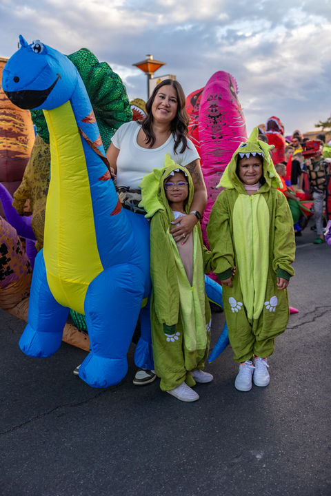 Mom and kids dressed as dinosaurs