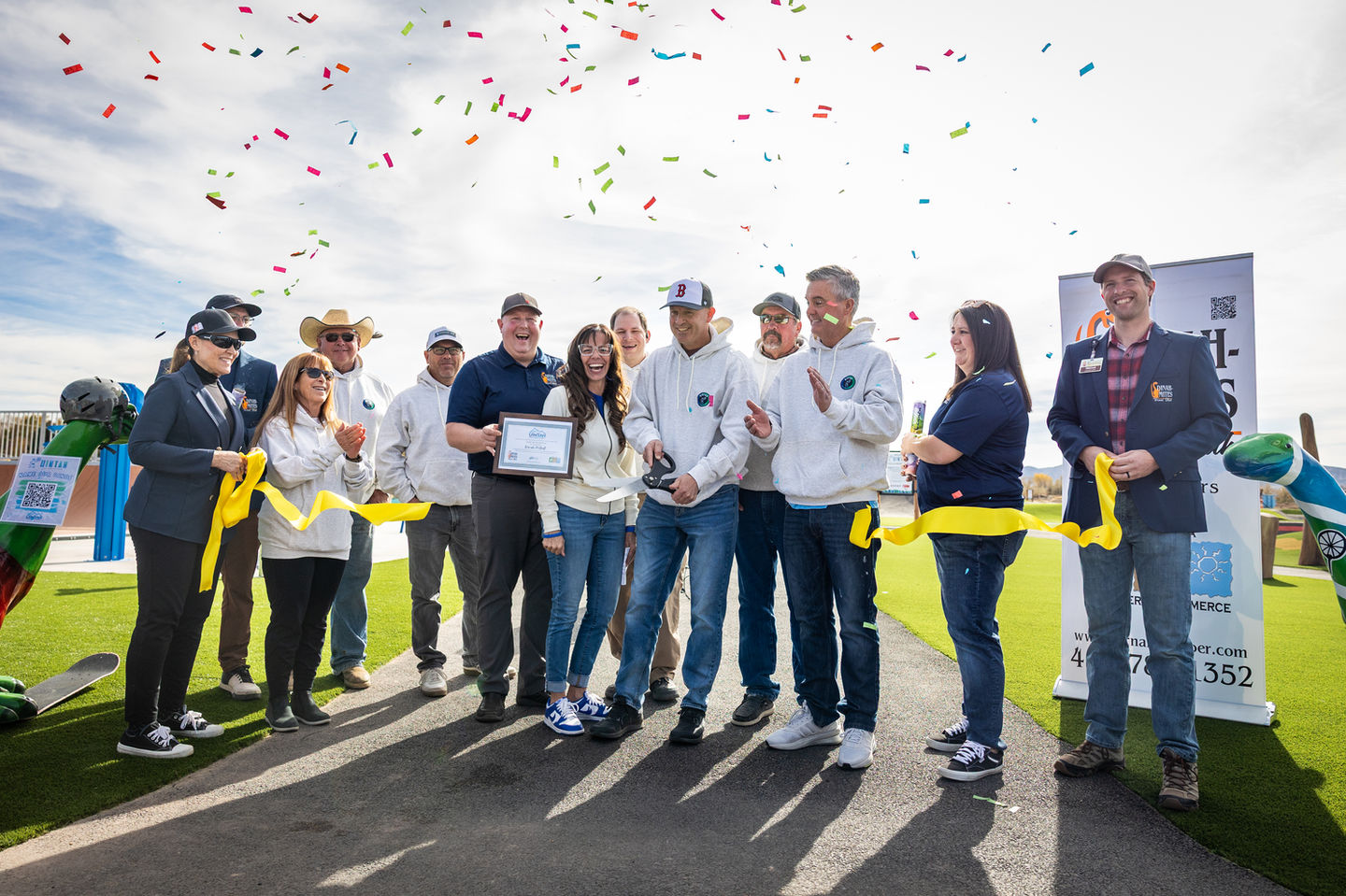 Group of people celebrating the ribbon cutting