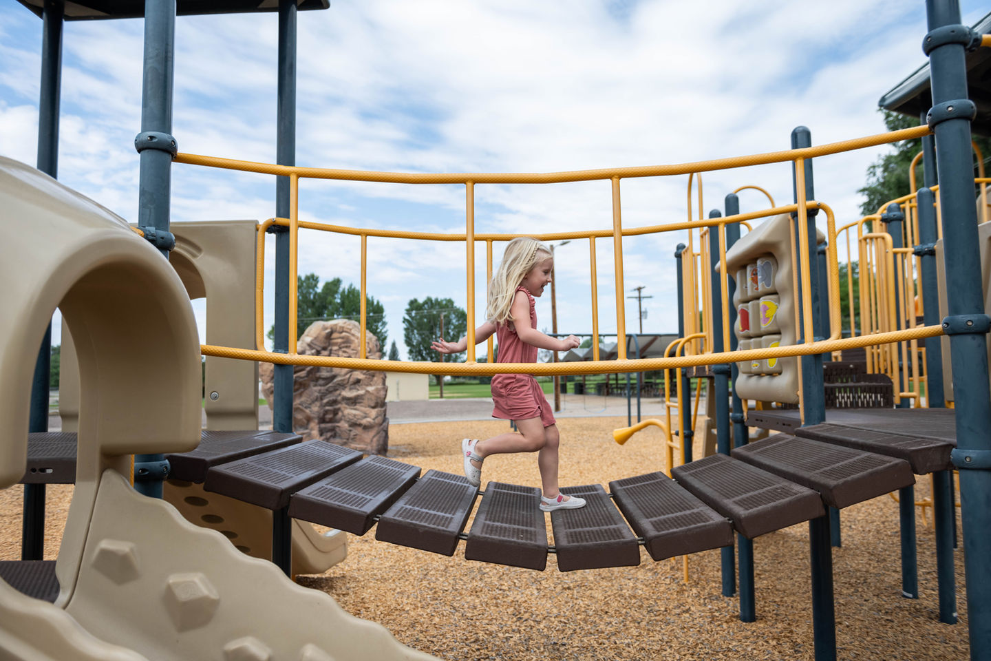 Girl on bridge at playground