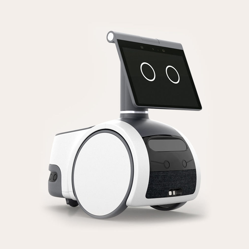 A compact Amazon Astro Home Robot product . It is a white and black robot with a screen displaying two circles, resembling eyes, set against a plain background.
