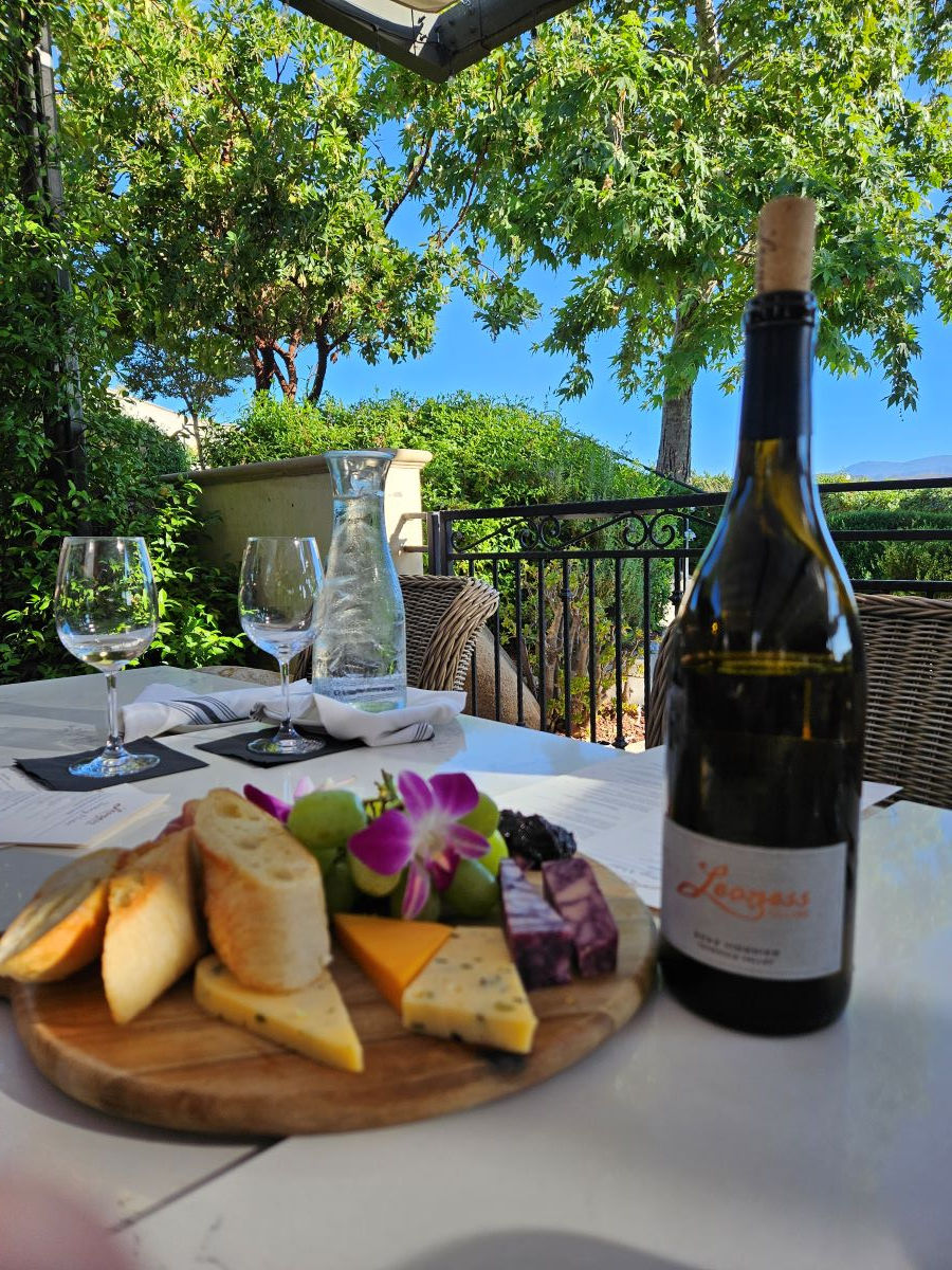 At the Leoness Winery a table with charcuterie plate and bottle of wine