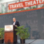 Peter Greenberg standing at a podium