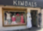 Store window filled with clothes and word Kimbals across the whole front..