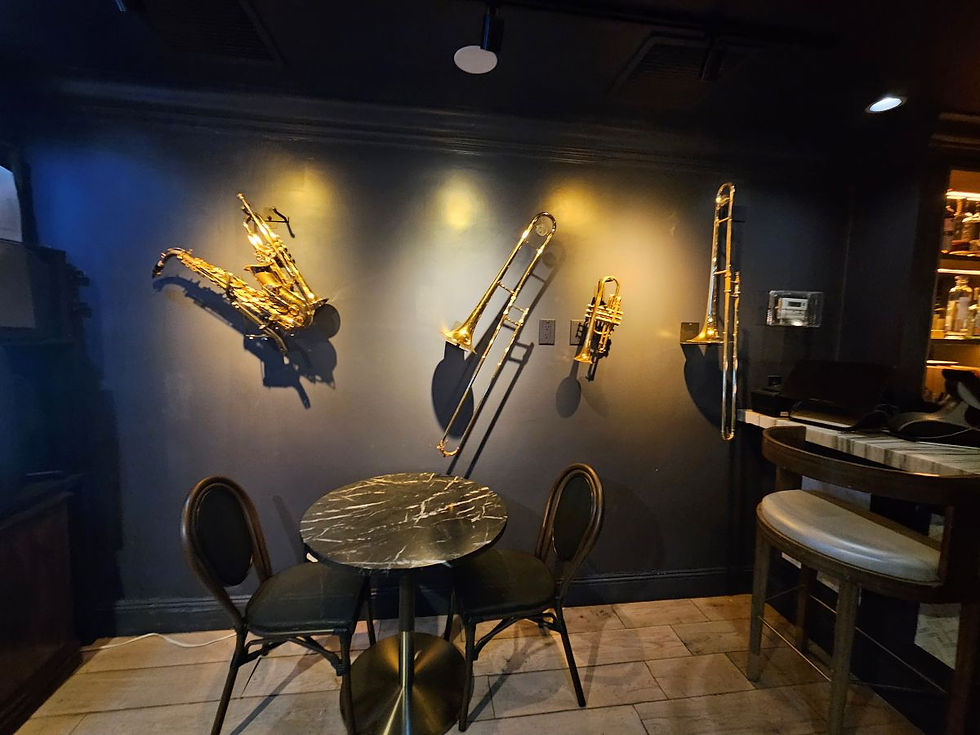 Table in front, and how the wall lit were brass musical instruments.