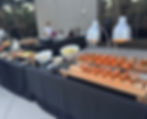 Buffet on patio with lots of small bites. 