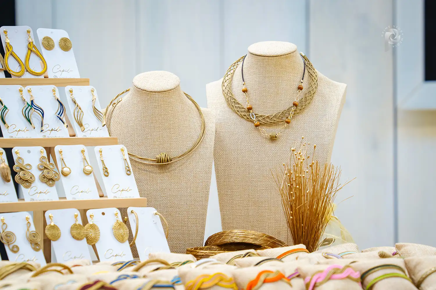 Image of necklace, bracelet, and earrings made from natural golden fibers