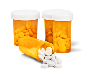 Four amber pill bottles