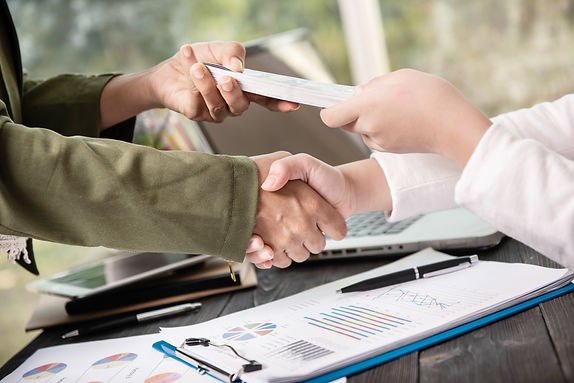 business-people-shaking-hands-finishing-up-meeting.jpg