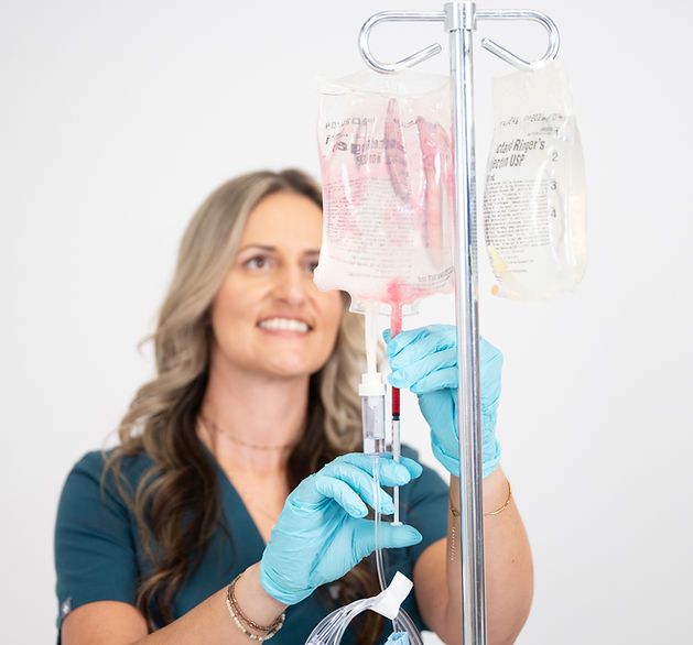 NURSE INJECTING IV BAG