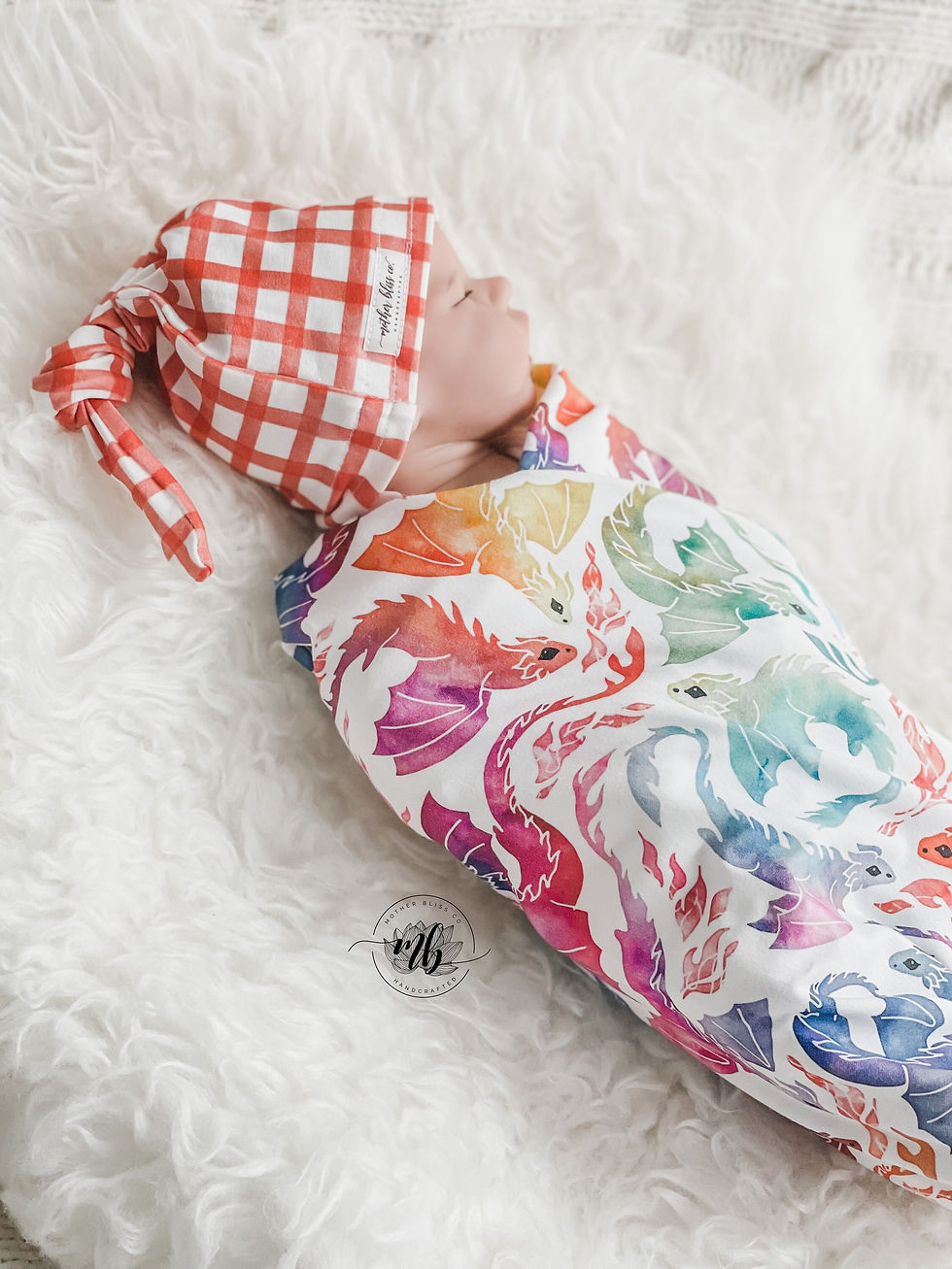 Thumbnail: Rainbow Dragons Swaddle Blanket with Coordinating Knotted Gingham Hat | Soft Bla