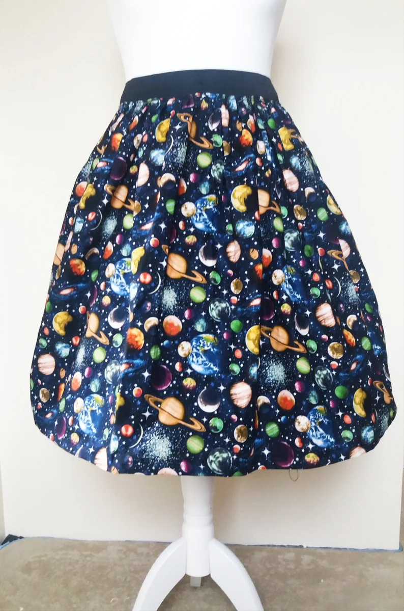 A midi skirt decorated with different stars and planets