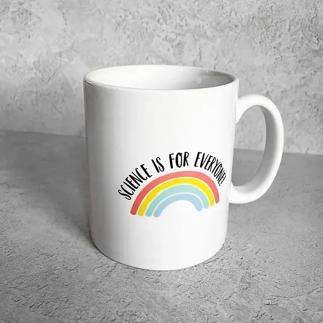 A white mug with a rainbow and the words 'science is for everyone'