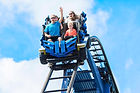 Young family having fun riding a rollerc