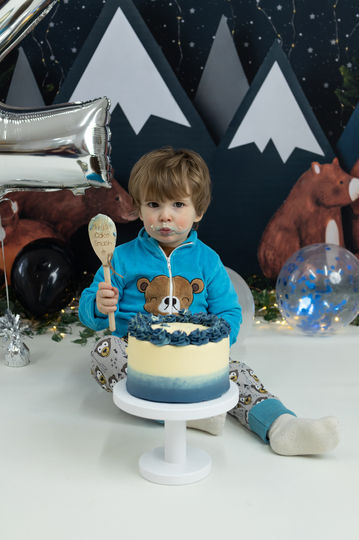 Birthday boy with cake and spoon.