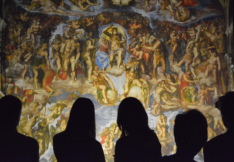 Silhouetted visitors admire a colorful, detailed mural depicting numerous human figures in dynamic poses, set in a dramatic, historical scene.