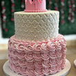 Two-tiered pink and white cake with crown, for birthdays, custom cakes