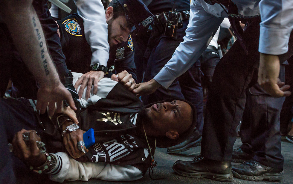 April 29, 2015 NYC: An activist is tackled and arrested after hundreds took part in a rally to show solidarity and outrage after the death of another unarmed black man. Twenty-five year old Freddie Grey died at the hands of Baltimore Police His death was ascribed to injuries to his spinal cord.