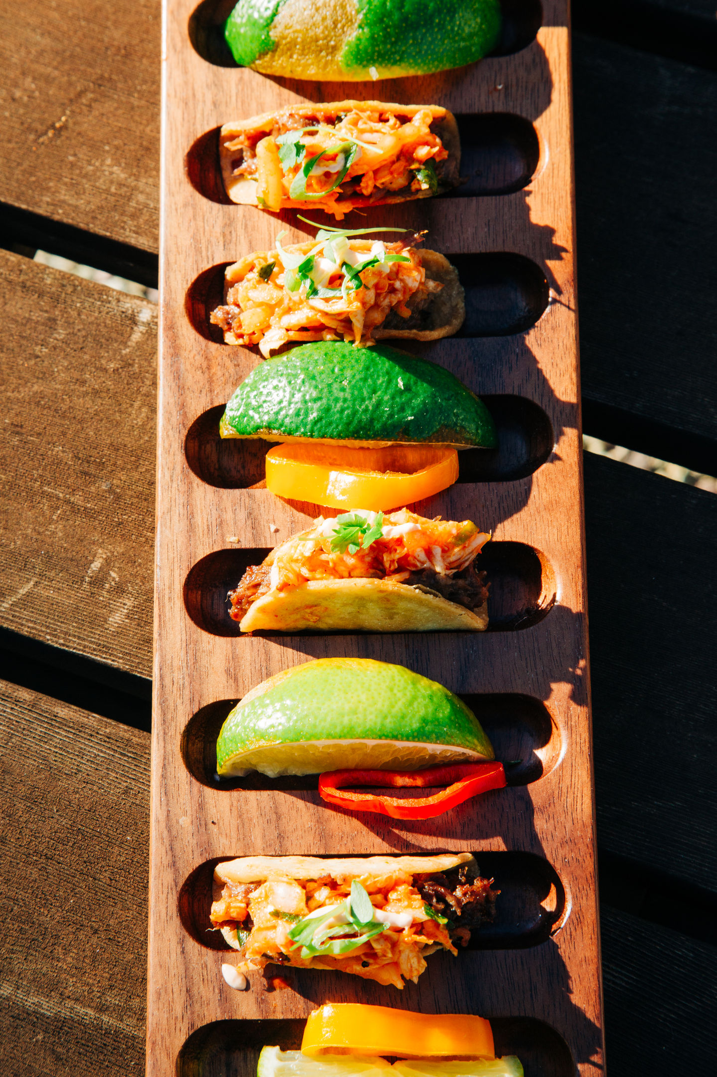 Mini tacos with avocado and fresh toppings served at a wedding catered by Tia’s Food of Love.
