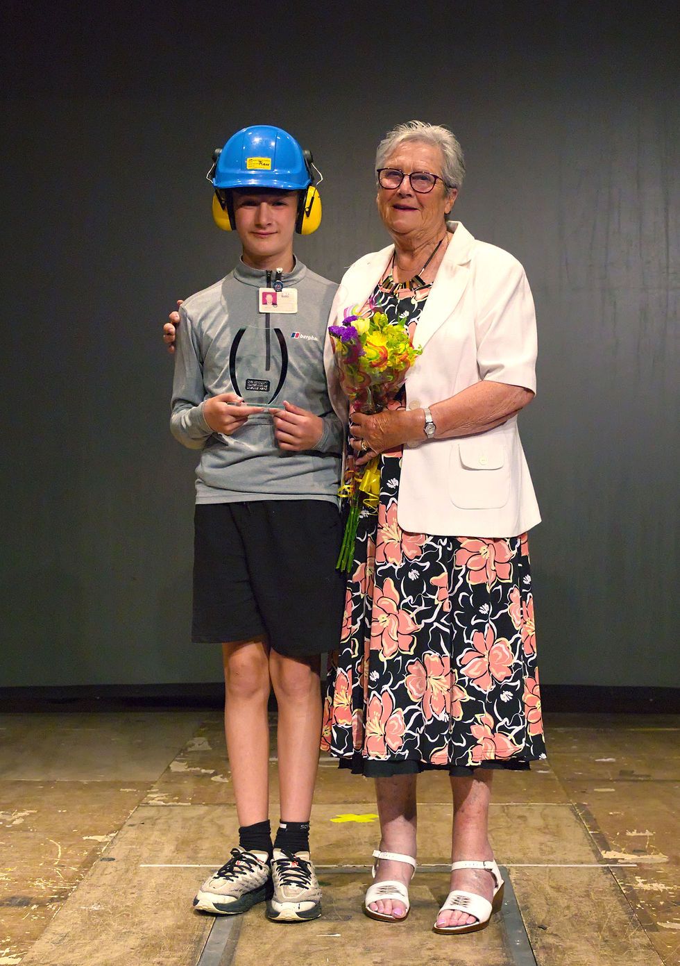 Ron Bird's wife, Ceinwin and granson, Harrison collecting his award