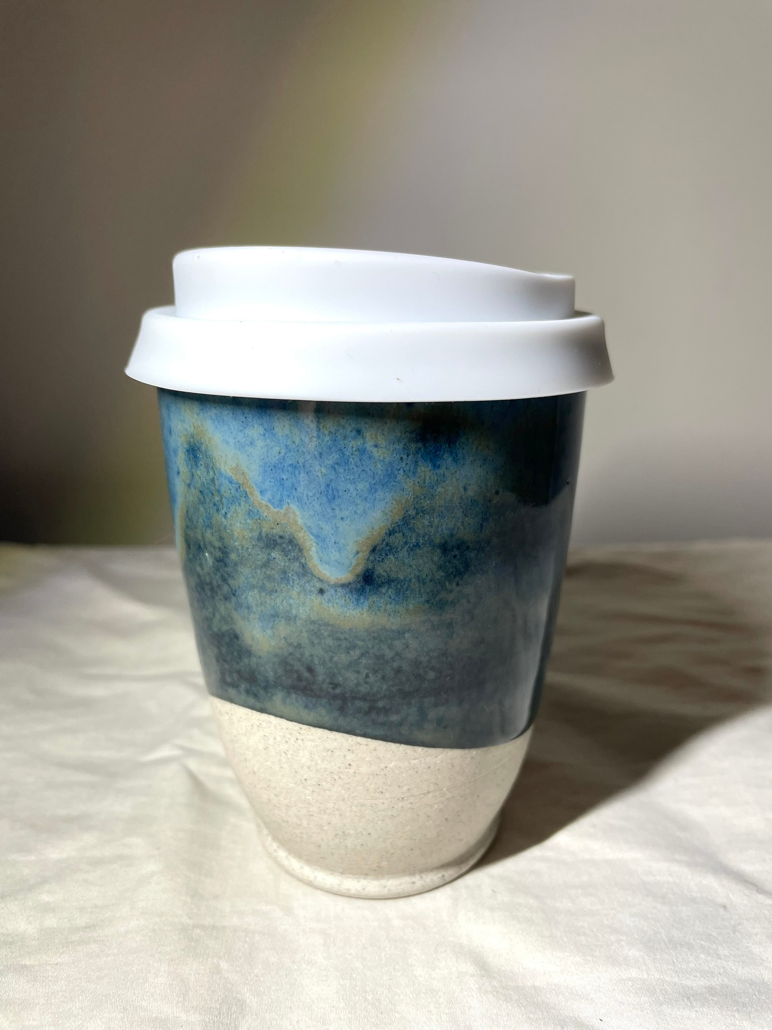 Keep Cup with Silicone Lid (white) in a Dark Blue Glaze