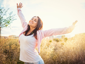 Happy young girl in the field