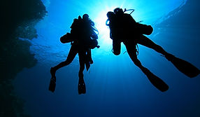 Silhouette of Scuba Divers
