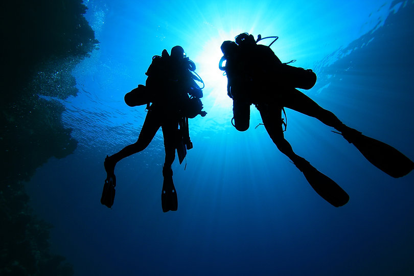 Silhouette of Scuba Divers