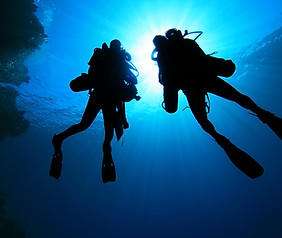 Silhouette of Scuba Divers