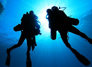 Silhouette of Scuba Divers