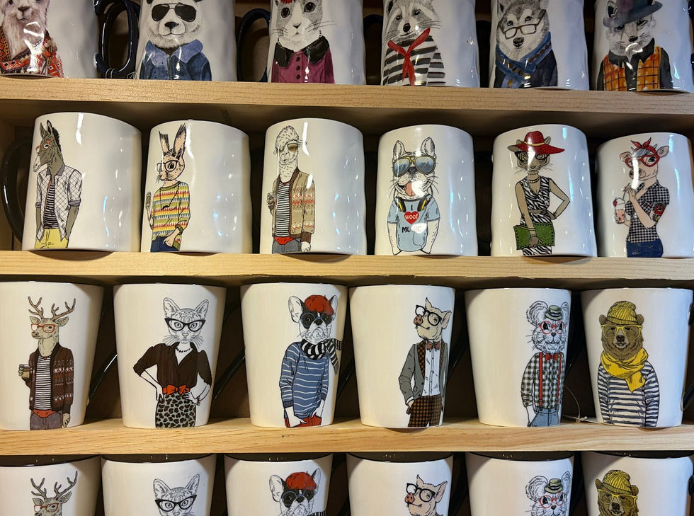Collection of pre-owned coffee mugs with animal illustrations