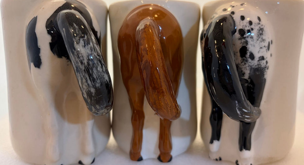 Three pre-owned coffee mugs with horse tail handles.