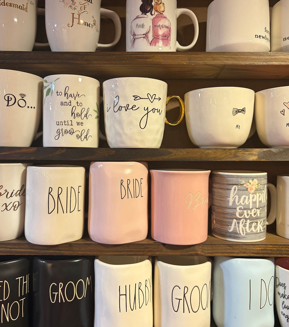 Collection of pre-owned coffee mugs on wooden shelves.