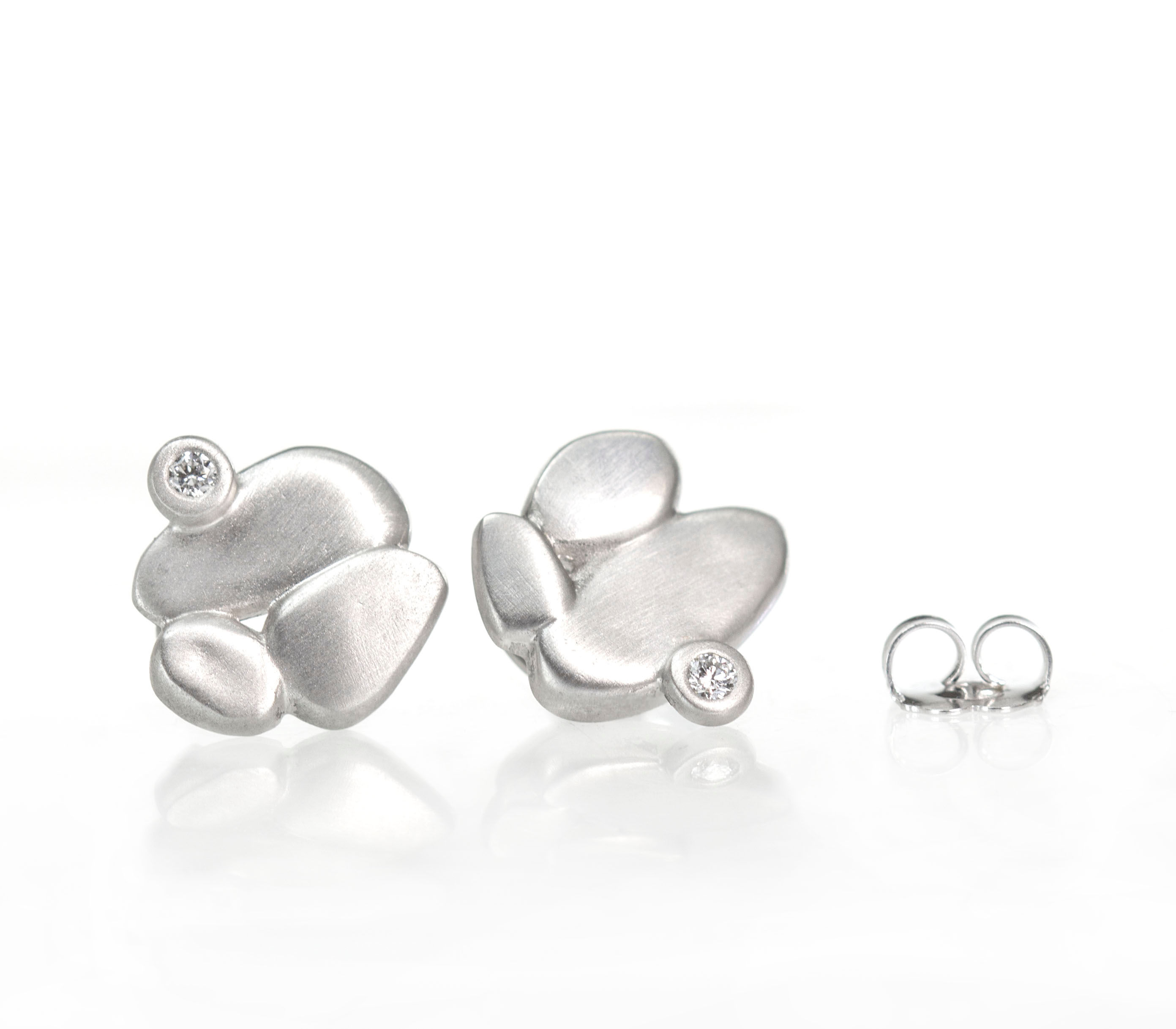 platinum clustered pebble studs with diamonds