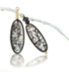 black tourmalined rutile in quartz pebble drops with diamonds