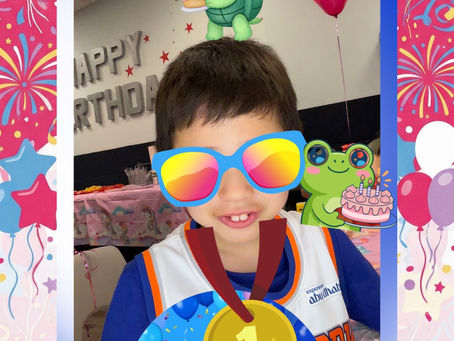 Boy wearing fun digital sunglasses in custom photo booth frame at NYC kids birthday party