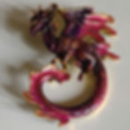 A red dragon brooch