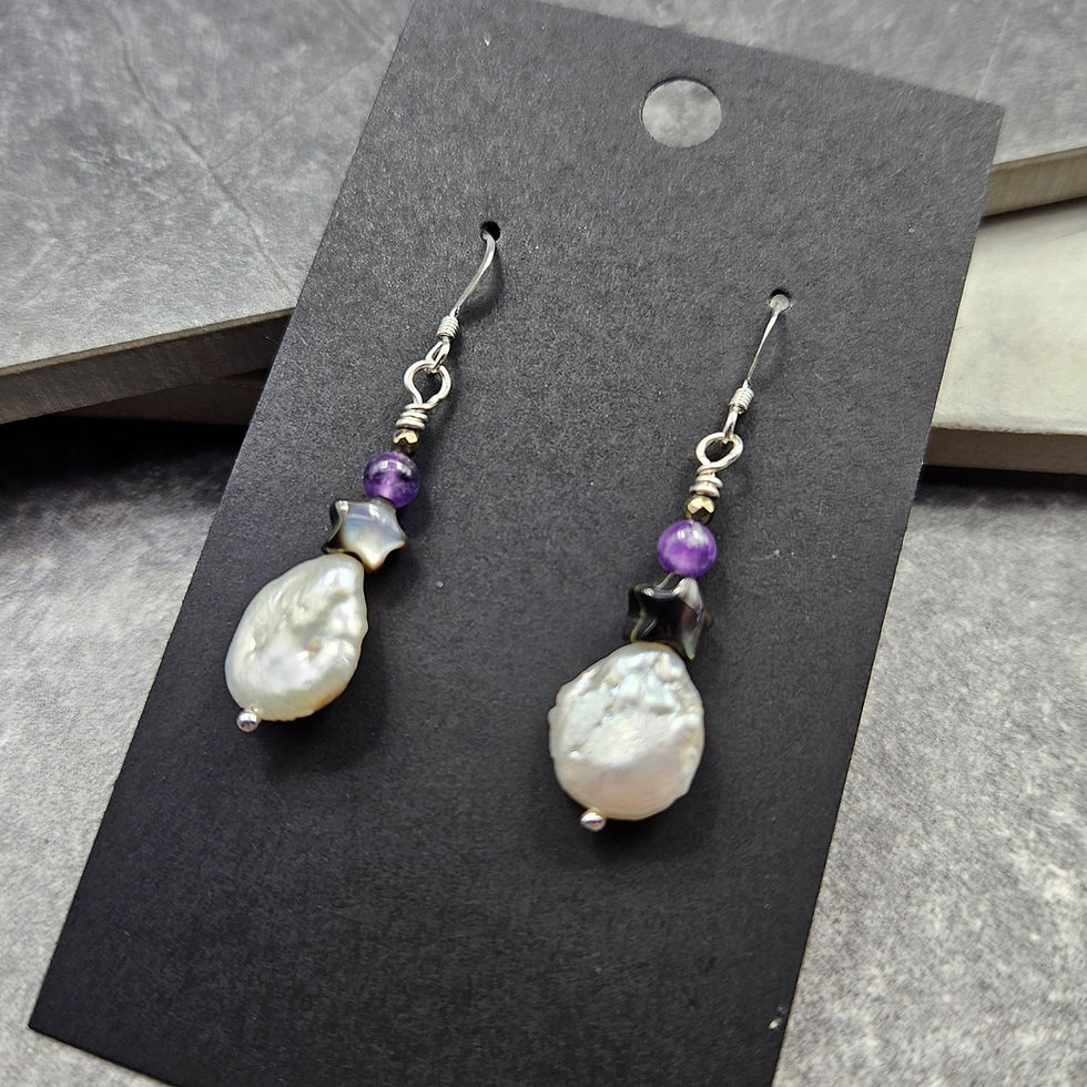 Amethyst rounds, black mother of pearl star and white coin pearl earrings on silver hooks